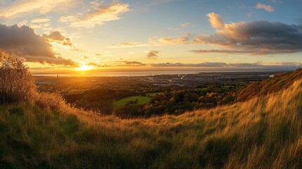 Obraz premium Golden sunset landscape over cityscape beautiful view hilltop scenery amazing nature sky day calm