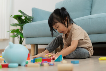Happy Asian child playing and learning toy blocks. children are very happy and excited at home....