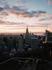 A cityscape with skyscrapers and people.