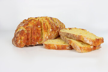 Sliced corn bread isolated on a white background. Golden crust and soft yellow interior