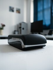A stapler sits on top of an office desk.