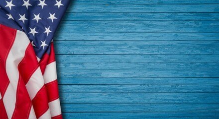 Naklejka premium Stars and Stripes: An American Flag Laying on a Rustic Blue Wood Plank Surface