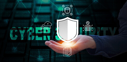 A conceptual image symbolizing cybersecurity, with the word "Cybersecurity" overlaid on a keyboard, and a hand holding a protective shield, highlighting data safety and digital defense.