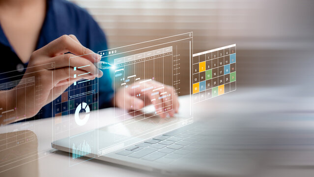 Person using digital Gantt chart on laptop with project calendar and data analytics interface. Concept of project management, scheduling, productivity, and planning with smart tools.