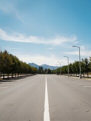 An empty street with mountains in background.