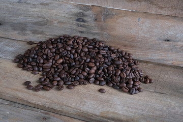 Coffee beans on a wooden background