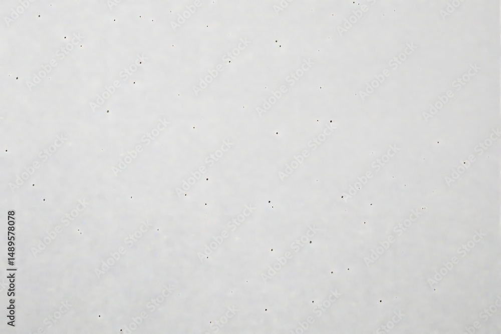 Poster white paper background with small scattered ink dots, minimalist graphic style on a plain background