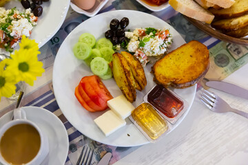 Delicious, nutritious breakfast at the hotel with vegetables, salad, cheese, olives and bread...