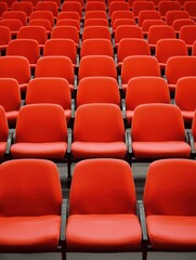 Rows of Bright Red Chairs in a Minimalist Auditorium Setting