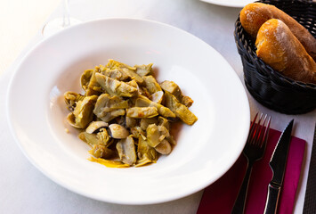Appetizing artichokes with sea shellfish