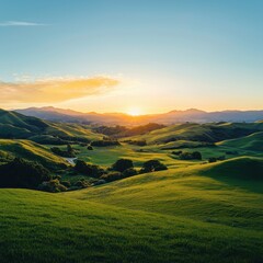 Fototapeta premium Sunset over rolling green hills scenic landscape photography nature tranquil environment aerial view