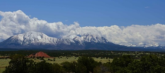 the dramatic snow-capped spanish peaks of the southern colorado rockies on a sunny summer day, near walsenburg