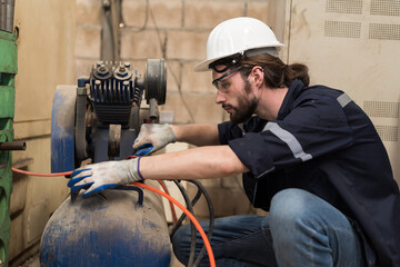 Engineer worker setup, maintain, repair mechanism of operation of air compressor in industry...