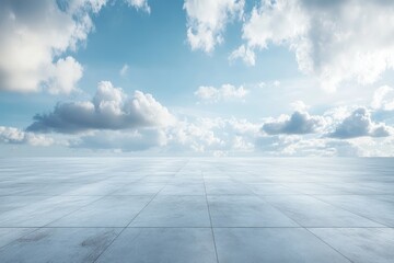 Empty paved plaza under a vast, partly cloudy sky