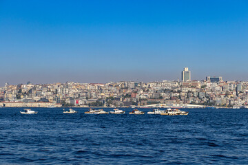 Images of historical Istanbul and the Bosphorus. The photograph includes tourists, ferries and flying birds. Hagia Sophia. Sultan Ahmet Mosque. Suleymaniye. Eminonu. Sirkeci. 