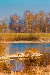 Spring landscape with reflections on a sunny day at Muehlham, Osterhofen, Deggendorf,Bavaria,...