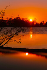 Spring sunset or sundowner view with reflections near Plattling, Isar, Deggendorf, Bavaria, Germany