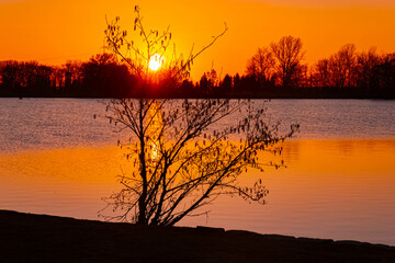 Spring sunset or sundowner view with reflections near Plattling, Isar, Deggendorf, Bavaria, Germany