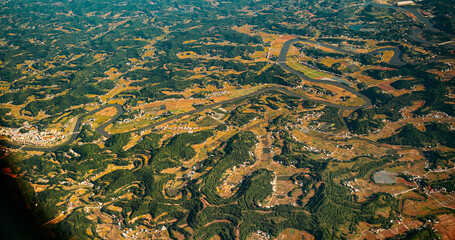 View From Airplane Window On Surroundings Of Chengdu, China. Min River In Central Sichuan Province. Tributary Of Upper Yangtze River, Which Flows Through Chengdu And Joins At Yibin. Mountainous Wooded
