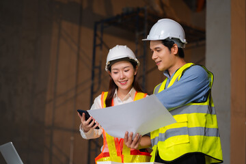 Construction engineers discussion with architects at construction site or building site