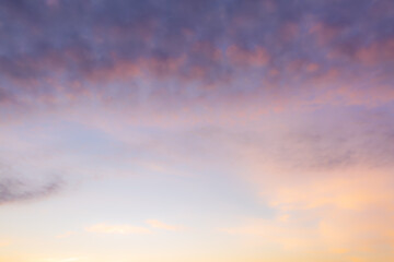Blurred multicolored sky background,The blur pastels gradient sunset background on soft nature sunrise peaceful morning beach outdoor. heavenly mind view at a resort deck touching sunshine.