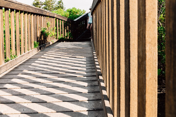 stairs leading to the beach, with slanting shadows