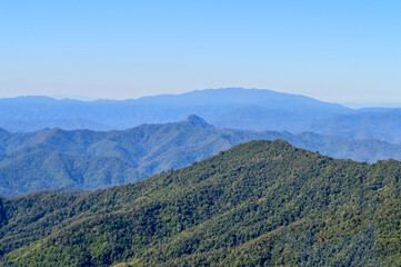 Fototapeta premium Distant Mountains and Forest with Trees and Sky in Northern Thailand.