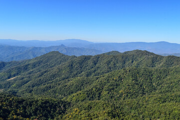 Fototapeta premium Distant Mountains and Forest with Trees and Sky in Northern Thailand.