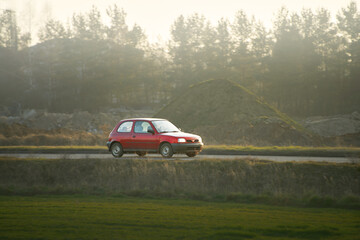 Compact European vehicle in motion outdoors