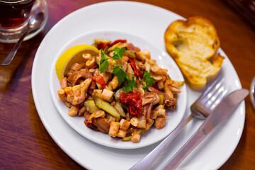 Delicious octopus salad with parsley and lemon. Turkish cuisine