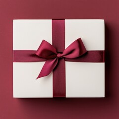 Elegant White Gift Box with Burgundy Ribbon on Red Background