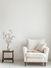 A neutral room featuring a chair with a soft throw