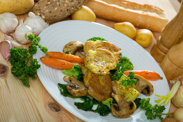 Appetizing Australian baked potatoes (Crash Hot Potatoes) with vegetable garnish and fresh greens
