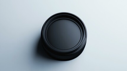 A realistic mockup of a branded camera lens cap on a white background