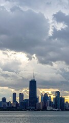 Fototapeta premium Dramatic Skyline of a City Under an Overcast and Cloudy Sky