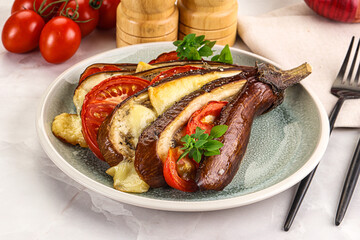 Baked tomato with mozzarella and tomato