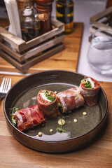 Prosciutto rolls with salad filling