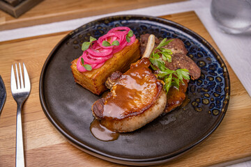 Grilled pork chop with potato gratin