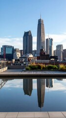 Naklejka premium Stunning City Skyline with Reflections in Rooftop Water Feature