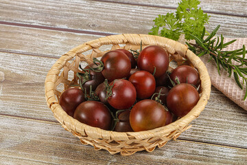 Juicy ripe black cherry tomato
