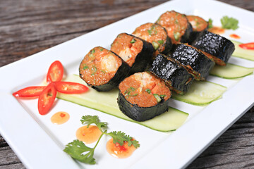Fried fish cakes stuffed with fresh shrimp inside Wrapped in seaweed sheets before frying