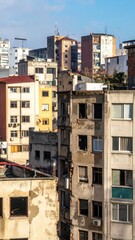 Urban Decay in City Skyline with Crumbling Facades and Broken Windows