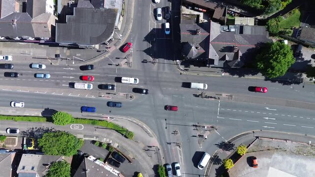 Aerial view of  traffic  from above &ndash; surrounded by historic homes Ideal for editorial, real estate, and travel use.