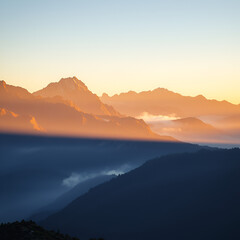 Obraz premium Golden Sunrise Over Misty Mountain Peaks