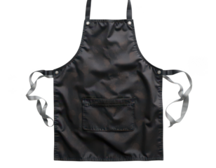 a black apron is centered against a black background. the apron has shoulder straps and side ties. it also features a front pocket, placed near the bottom, in the center of the apron