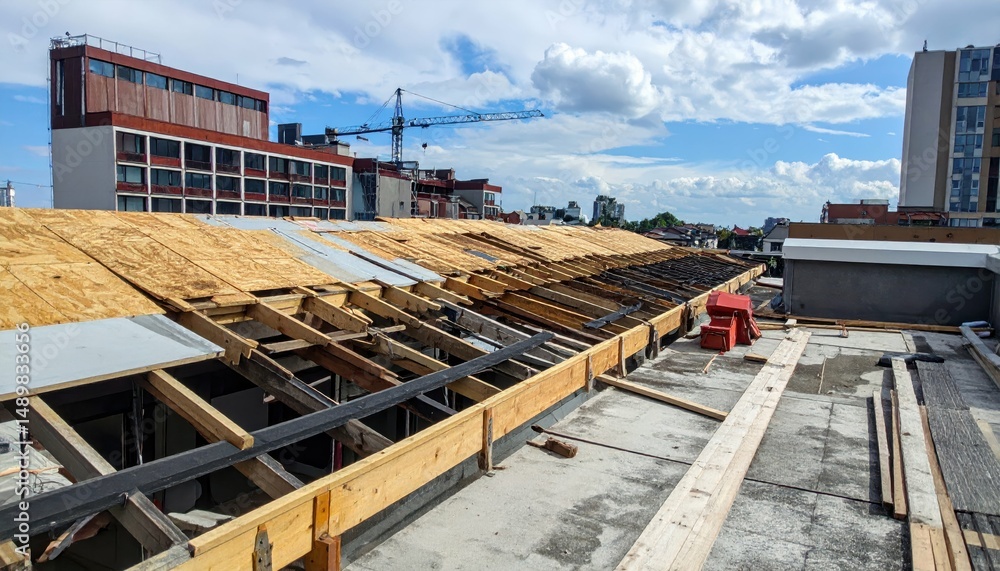 Poster rooftop undergoing transformation with scaffolding and construction elements