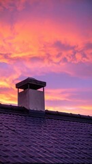 Fototapeta premium Surreal Rooftop View Under Strange Colored Sky at Dusk