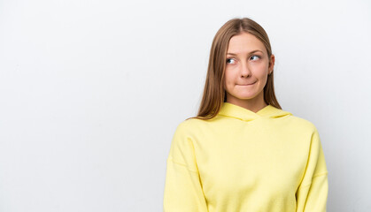 Obraz premium Young Russian woman isolated on white background having doubts while looking up