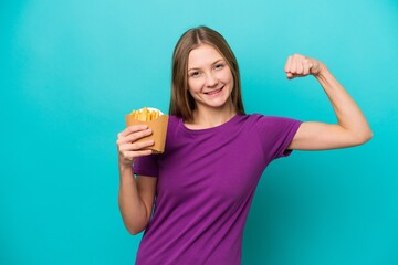 Young Russian woman catching french fries isolated on blue background doing strong gesture