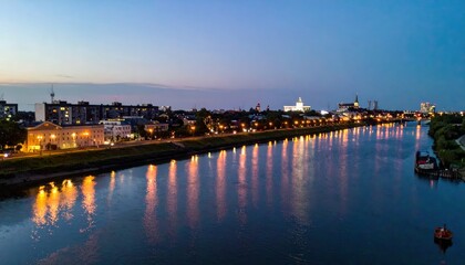 Fototapeta premium Stunning Rooftop View of River with Reflections of City Lights at Dusk